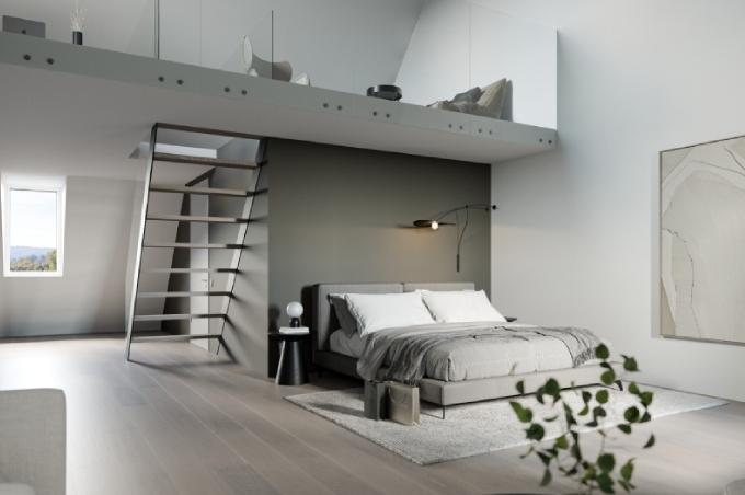 Schlafzimmer mit Bett und Treppe an der Dorfstrasse in Zwingen