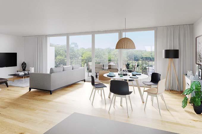 Wohnzimmer mit Sofa, Esstisch, Stühlen und Balkon am St. Benedikt in Erschwil
