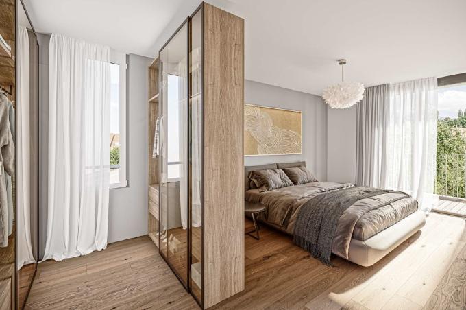 Schlafzimmer mit Bett, Schrank und Balkon an der Breitenbachstrasse in Laufen