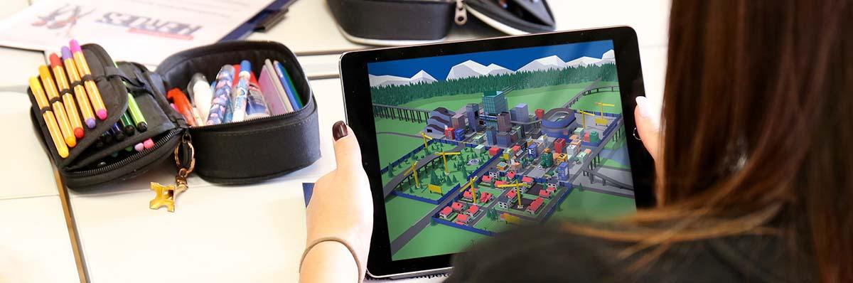 Mädchen spielt auf ihrem iPad ein Videospiel.