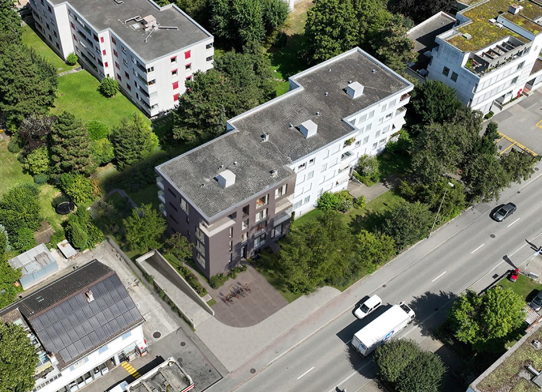 Drohnenaufsicht des Mehrfamilienhauses mit Eigentumswohnungen an der St. Jakob-Strasse in Muttenz.