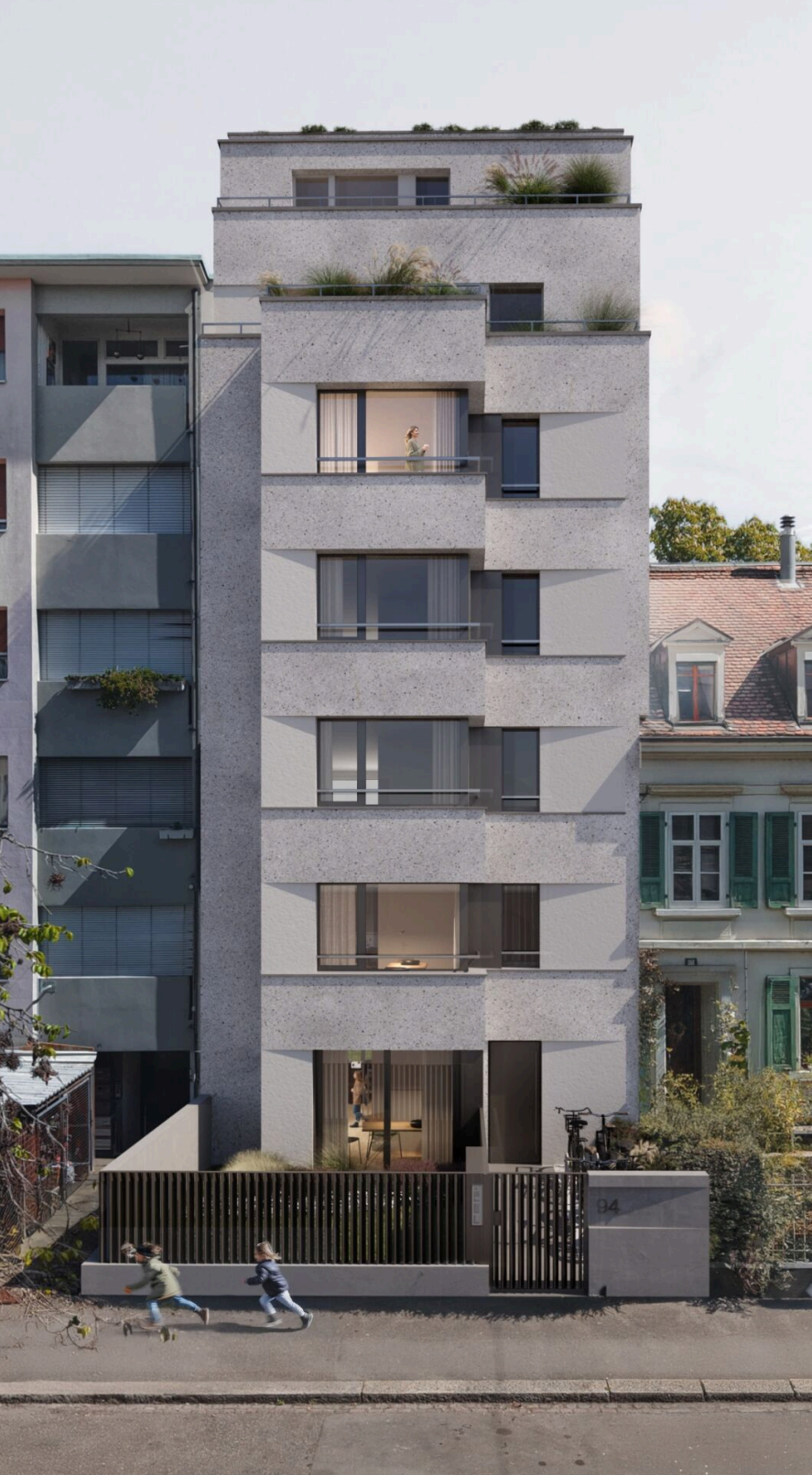 Modernes mehrstöckiges Gebäude mit schlankem Design und Grünflächen, gelegen in einem städtischen Gebiet.