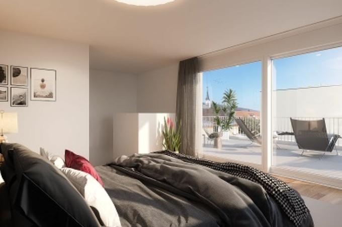 Schlafzimmer mit Bett und Balkon an der Hinterfeldstrasse in Laufen