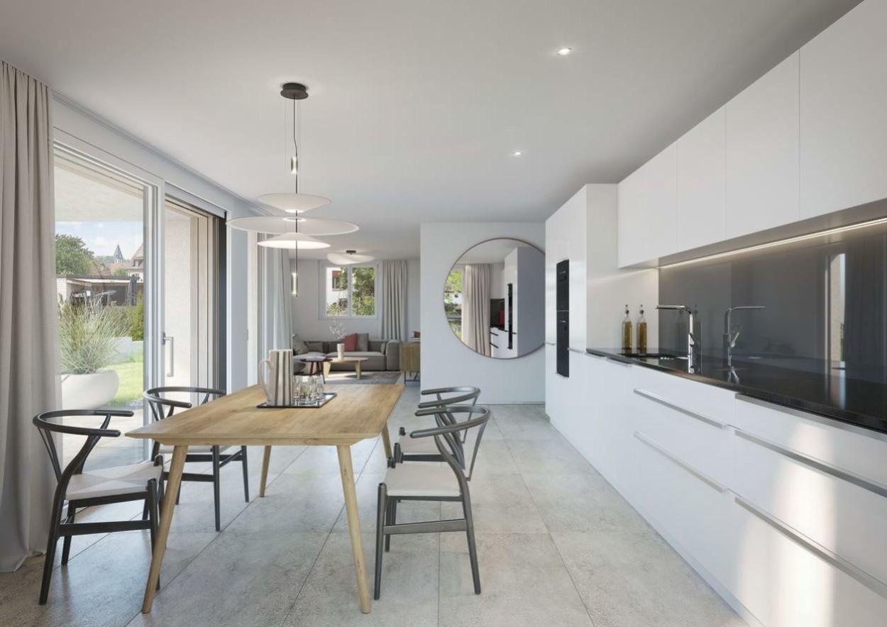 Moderne, helle Küche mit weißen Schränken, Arbeitsflächen und eingebauter Beleuchtung am Oberdorfweg in Wallbach.