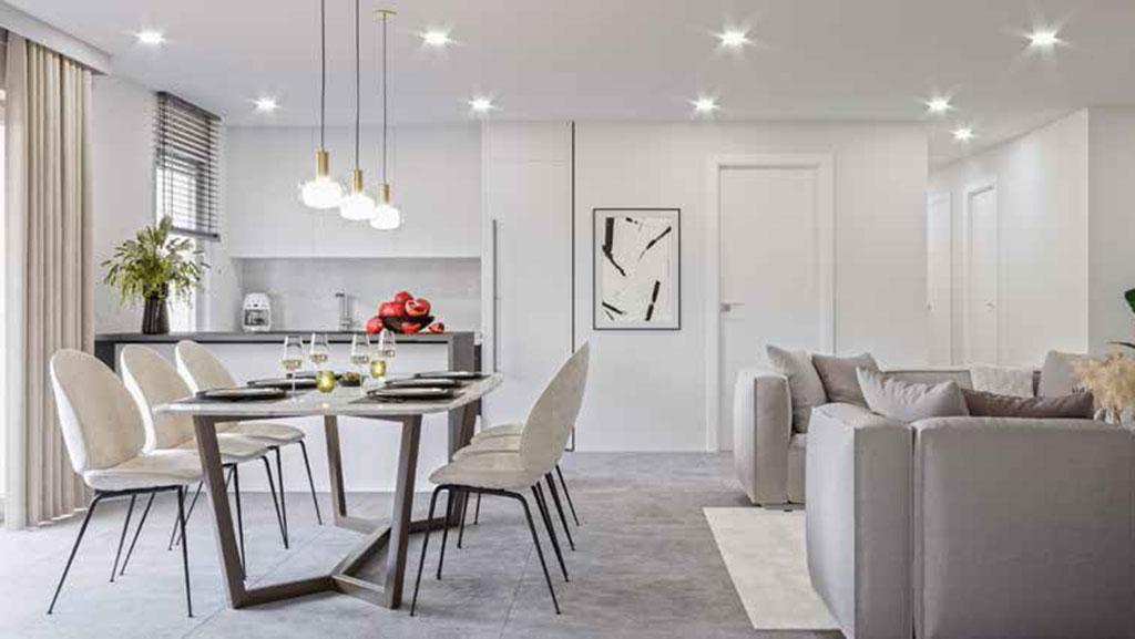 Wohnzimmer mit Esstisch, Stühlen, Küche und Sofas am Selmattweg in Wahlen