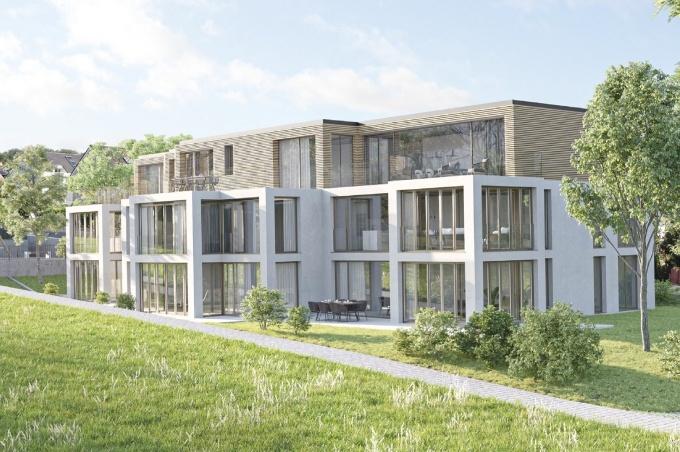 Mehrfamilienhaus mit Eigentumswohnungen und Rasen am Jakobsweg "Basel Grün" in Biel-Benken