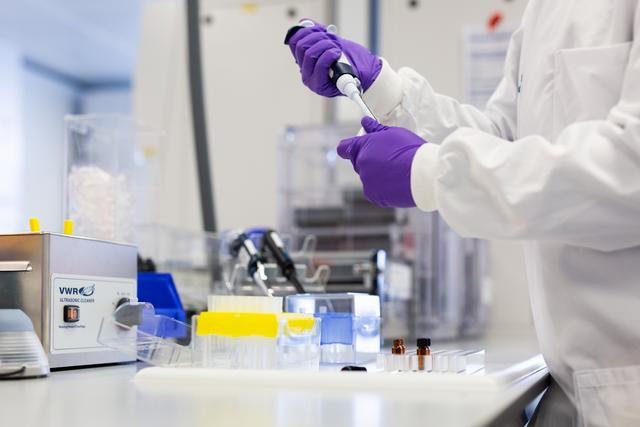 Scientist working with lab equipment in lab