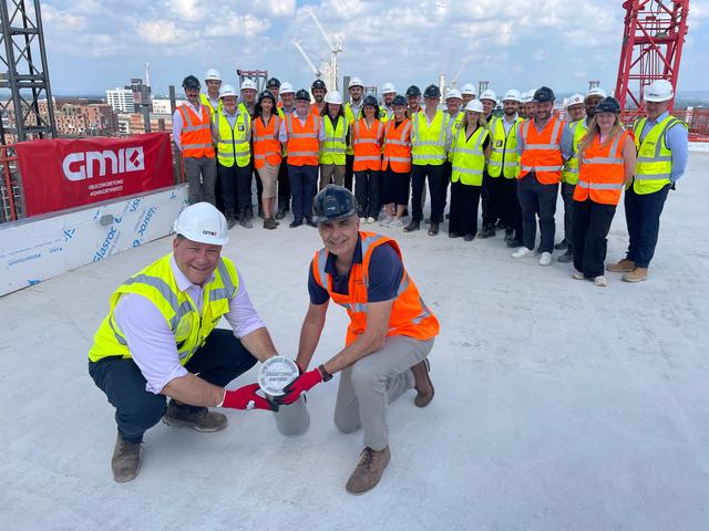 people on rooftop in manchester city centre on no.3 circle square
