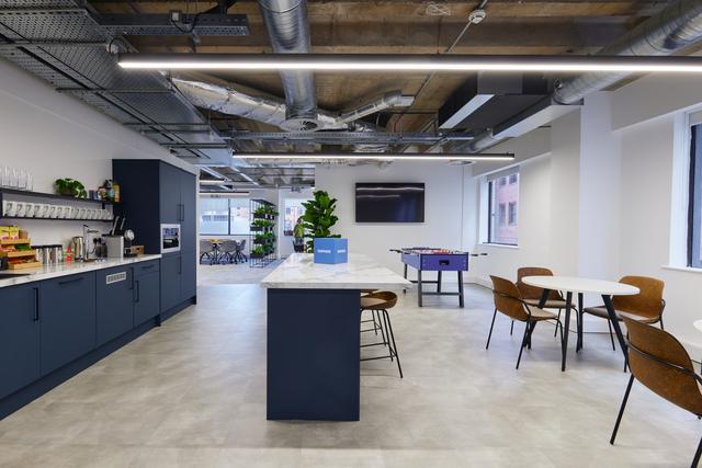 Kitchen and breakout space in customer suite