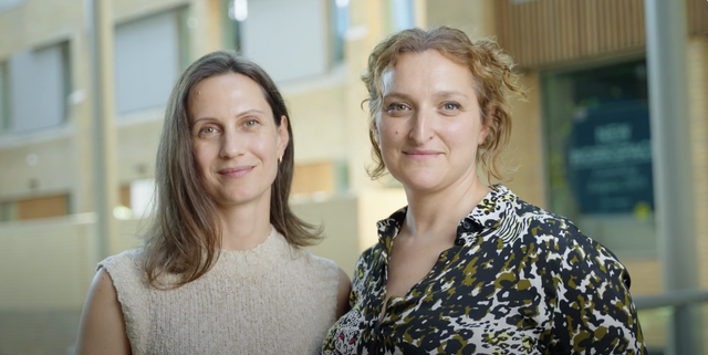 two women smiling into camera