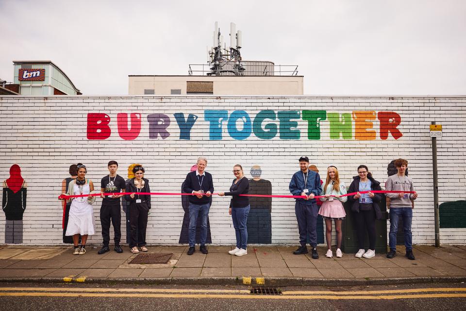 Bury College students and tutors unveil the new mural
