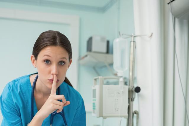 Nurse shows "be quiet" gesture
