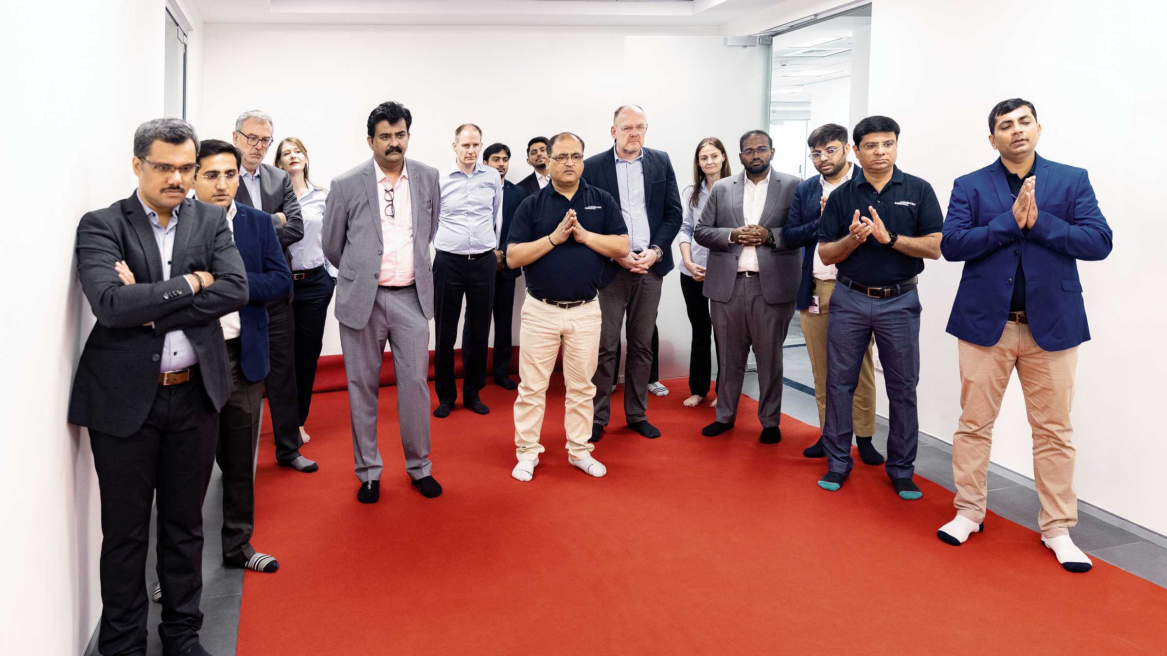 Hamilton Medical India employees watch the puja ritual