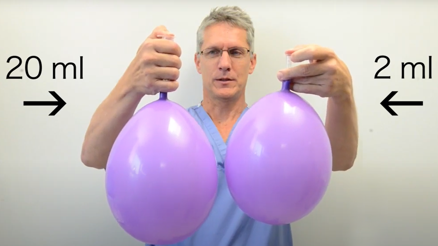 Photo Dr. Rechner holding two balloons