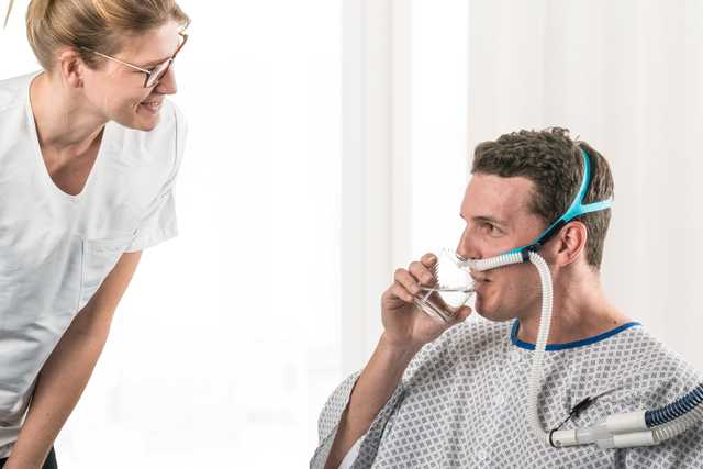 Adult wearing In2Flow Nasal cannula