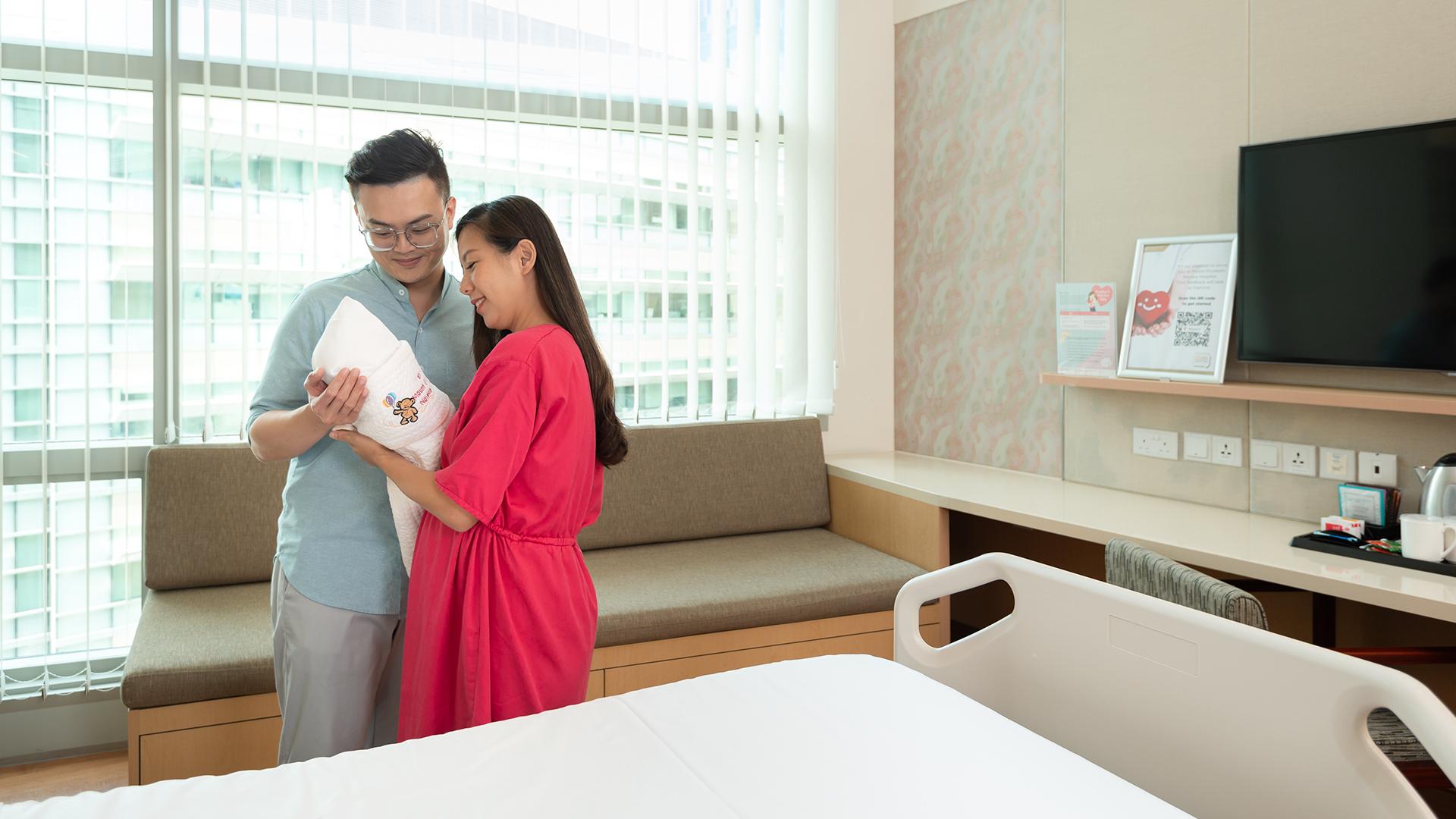 Maternity couple welcoming their baby in a comfortable and spacious maternity room