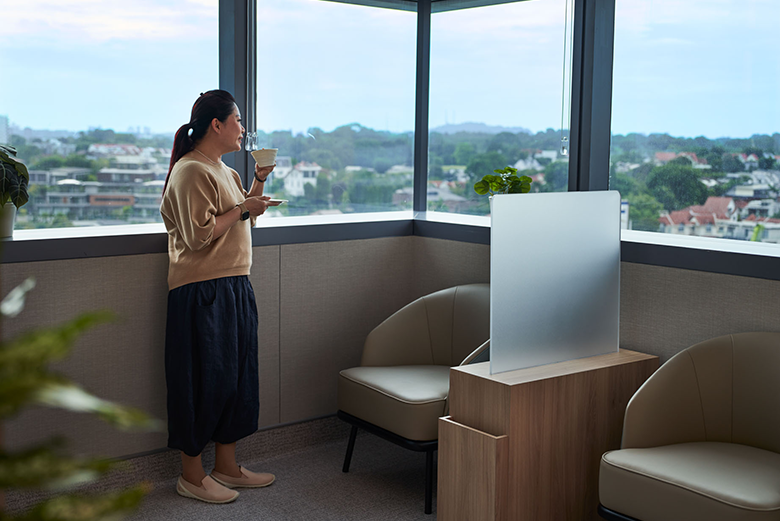 Lady looking out of window in hospital ward