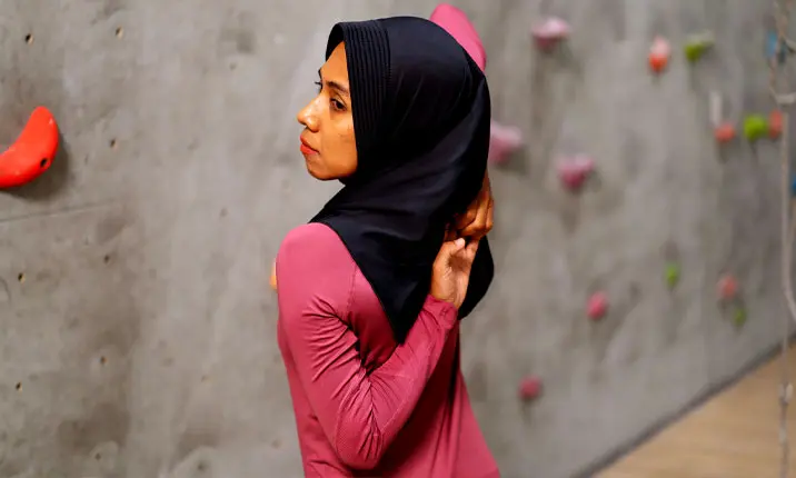 Woman stretching before climbing