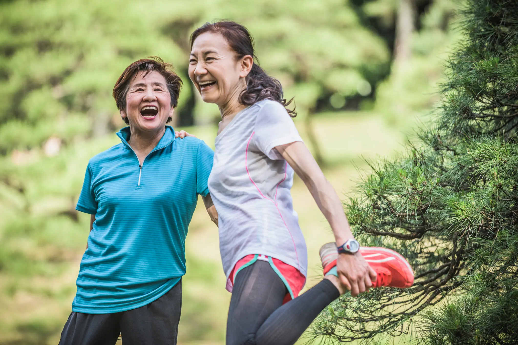 Two women exercising and stretching