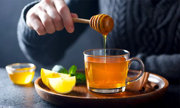 Honey and lemon drink to soothe your throat