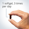 Hand holding a softgel, indicating a recommended dosage of one softgel three times per day for digestive support.