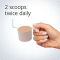 Hand holding a single scoop of Metagenics UltraGI Replenish® Gut Support - Chocolate Flavor, indicating recommended dosage.
