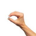 Hand holding a single Metagenics SpectraZyme® Pancreatic Enzymes tablet