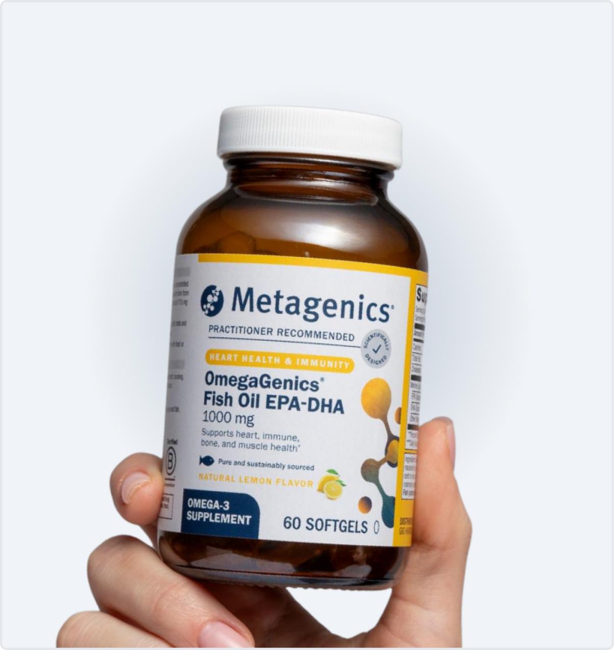Metagenics OmegaGenics Fish Oil EPA-DHA 1000 bottle held in hand, featured on the Black Friday page to showcase omega-3 support for heart and brain health.
