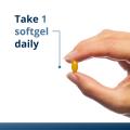 Woman’s hand holding Metagenics Vitamin D3 5000 + K softgel. 