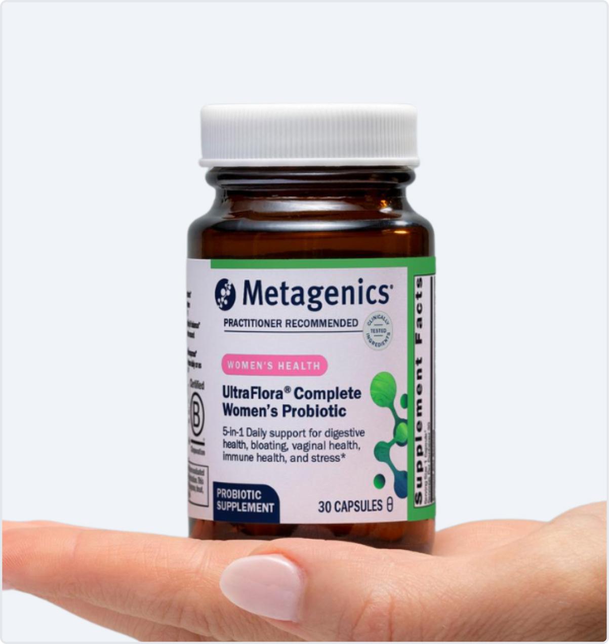Metagenics UltraFlora Complete Women’s Probiotic bottle held in hand, displayed on the Black Friday page to emphasize women’s vaginal, urinary, and gut health support.