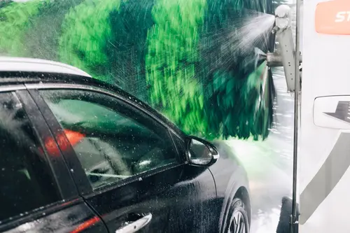 Image of a car being in a car wash 